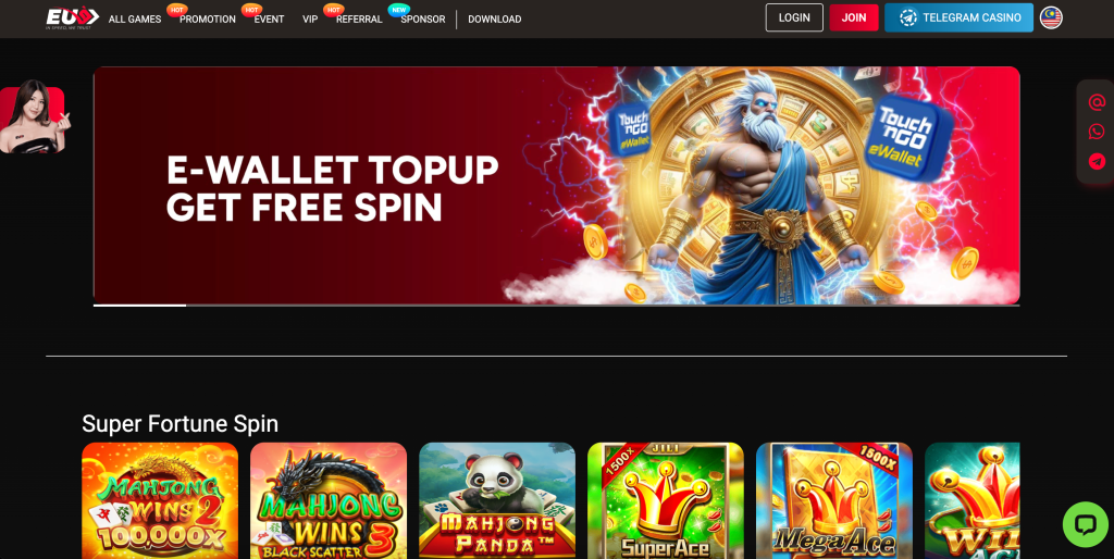 Homepage of EU9 online casino featuring a red promotional banner for "E-Wallet Topup Get Free Spin" with Zeus-themed artwork and Touch 'n Go eWallet logos